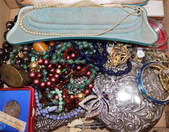 A quantity of costume jewellery including cultured pearl necklace, a silver hand mirror and a childs rattle.